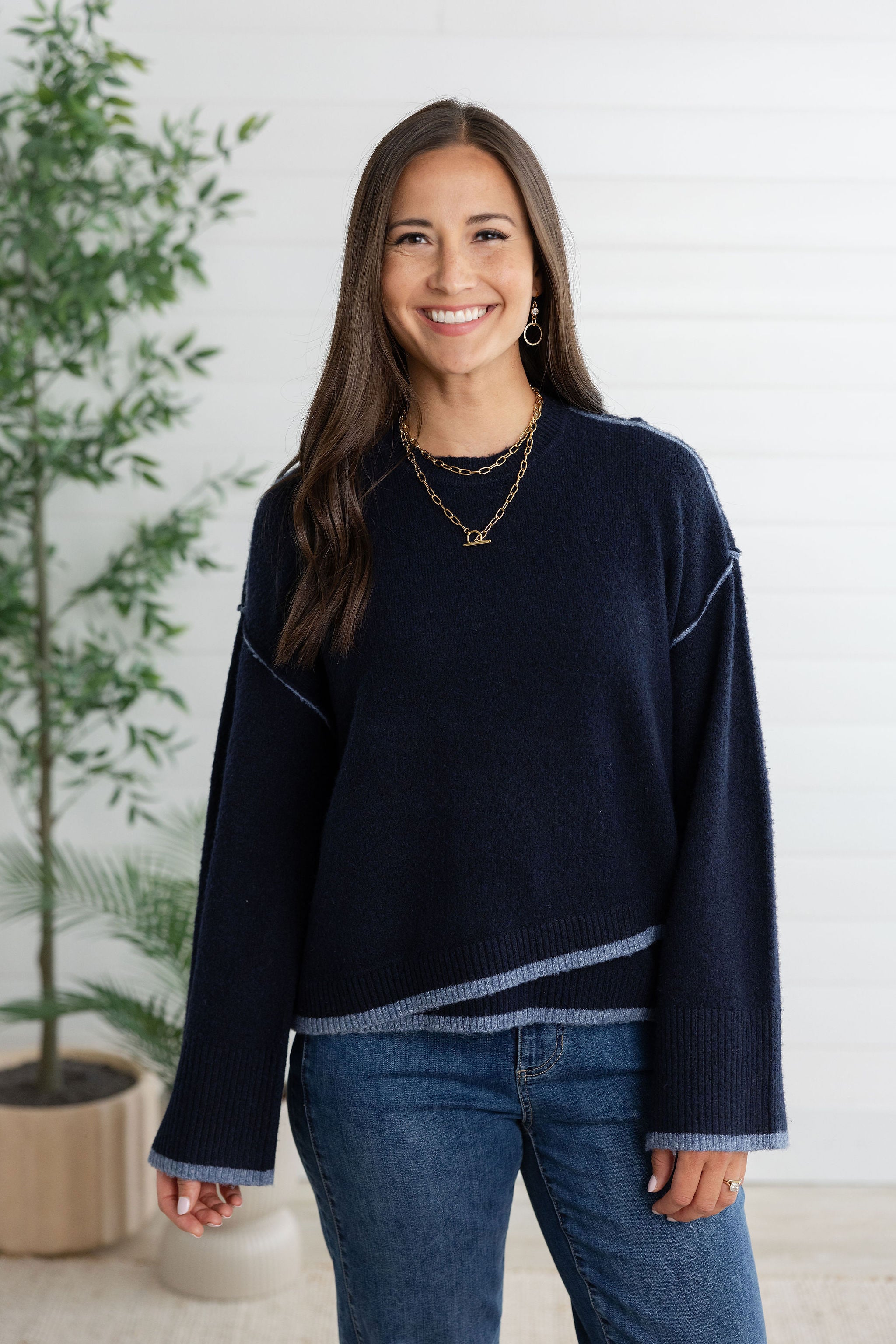 Cozy Knit Sweater with Asymmetrical Hem and Contrast Color Detail
