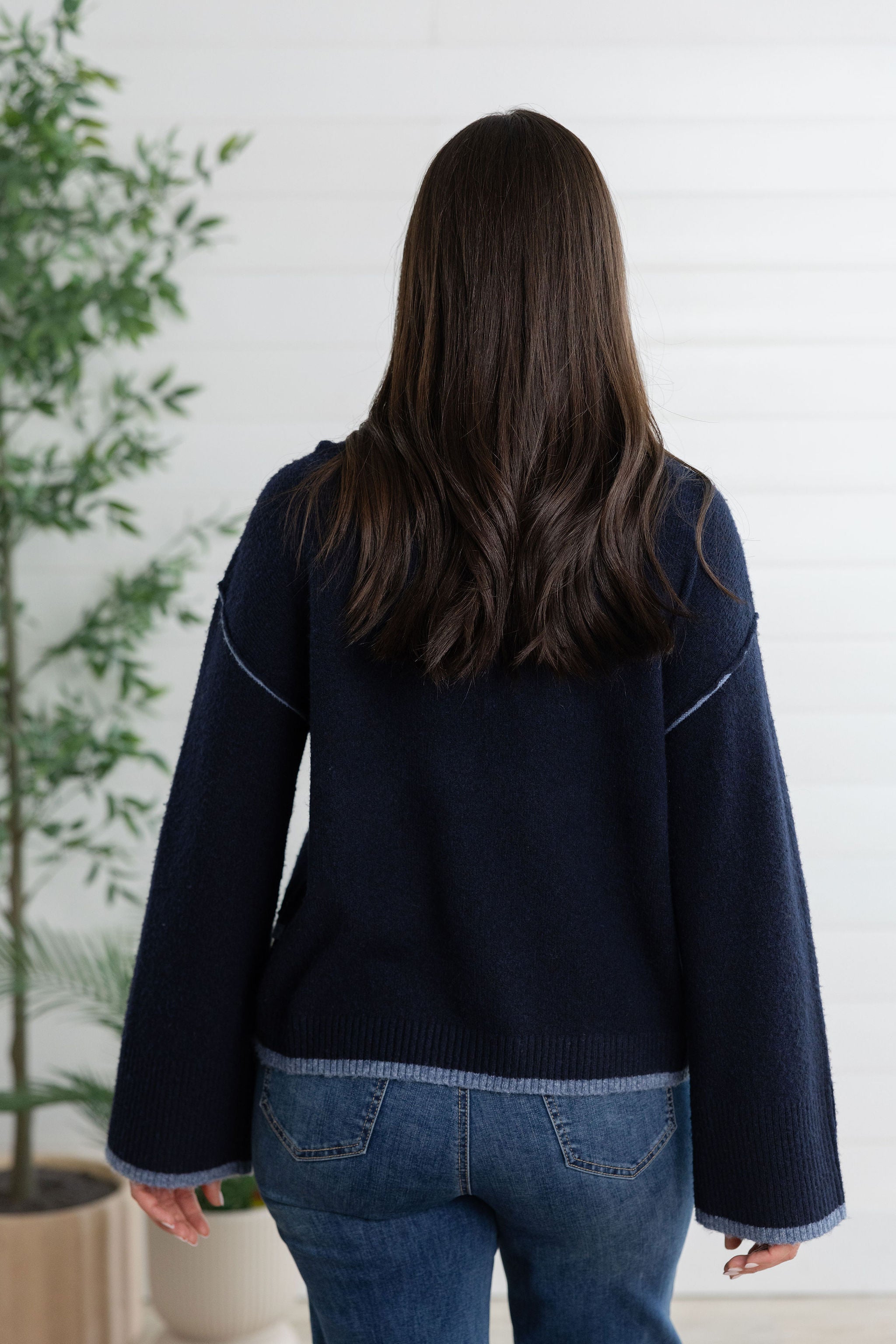 Cozy Knit Sweater with Asymmetrical Hem and Contrast Color Detail